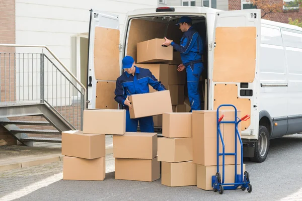 depositphotos 97125592 stock photo delivery men unloading boxes on